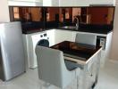 Modern kitchen with dining area and appliances