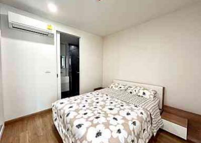 Cozy bedroom with double bed and air conditioning unit