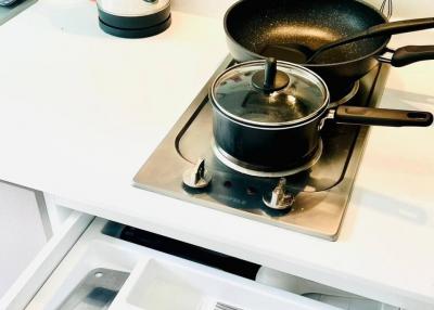 Modern kitchen with stainless steel appliances and organized drawers