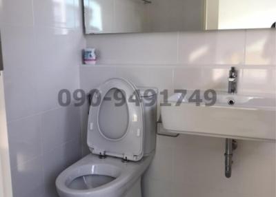 Modern bathroom interior with white fixtures