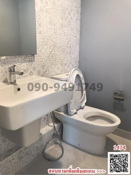 Bright bathroom with stylish tilework and modern fixtures