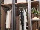 Well-organized closet with clothing and shelves