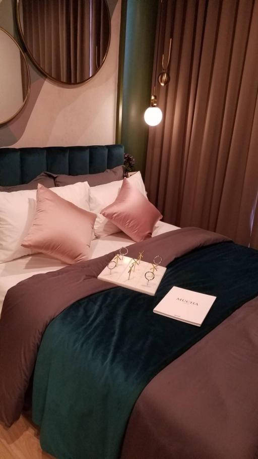 Elegantly designed bedroom with plush bedding and modern decor