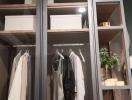 Modern bedroom wardrobe with clothes and storage