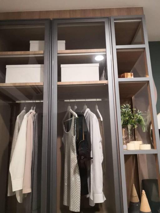 Modern bedroom wardrobe with clothes and storage