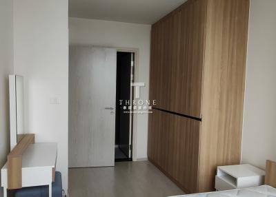 Modern interior design of a compact apartment entrance with wooden elements and a sleek finish