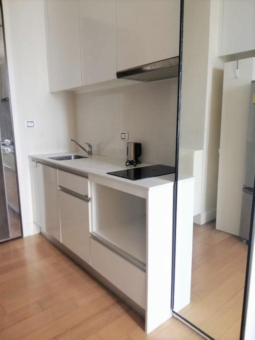 Modern kitchen with stainless steel appliances and sleek cabinetry