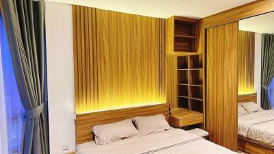 Cozy bedroom with wooden accents and ambient lighting