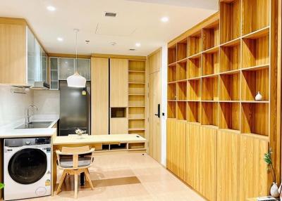 Modern kitchen with wooden finishes and built-in appliances