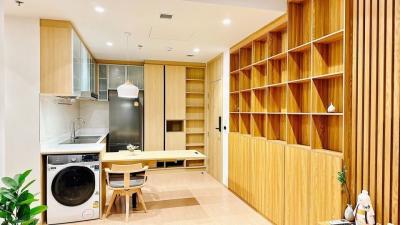 Modern kitchen with wooden finishes and built-in appliances