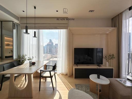 Spacious and modern living room with large windows and city view