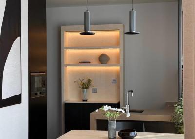 Modern kitchen with dining area and stylish pendant lighting