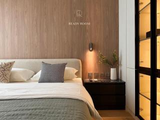 Modern bedroom with stylish interior design and wood paneling