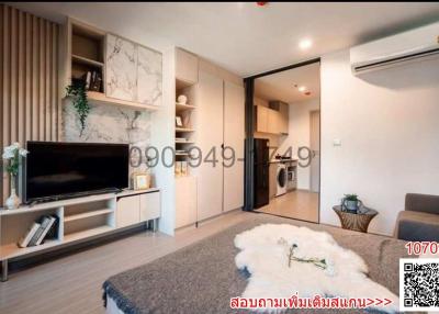 Spacious living room with modern decor and air conditioning