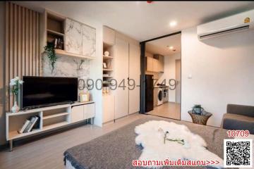 Spacious living room with modern decor and air conditioning