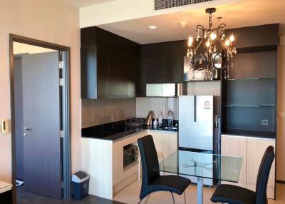 Modern kitchen with dining area and appliances