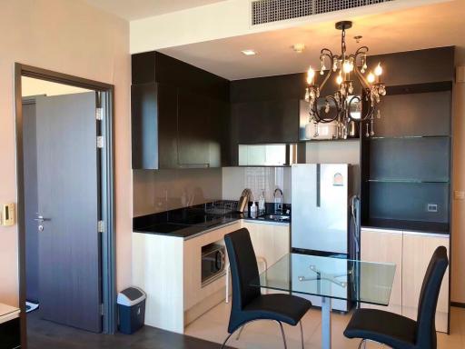 Modern kitchen with dining area and appliances