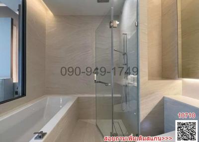 Modern bathroom interior with glass shower and bathtub