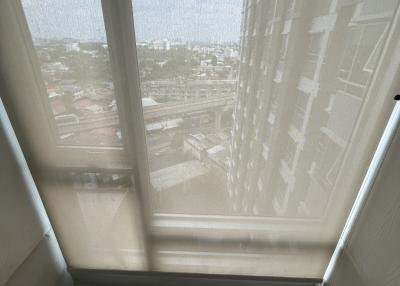 High angle view from a property showing the outside urban landscape through a large window
