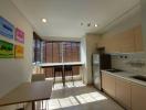 Modern kitchen with dining area and ample natural light