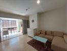 Spacious living room with natural light and modern furnishings