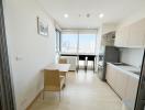 Modern kitchen with dining area and city view