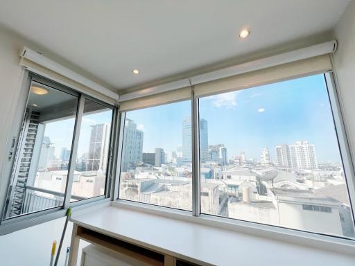 City view from a high-rise building window with clear daylight