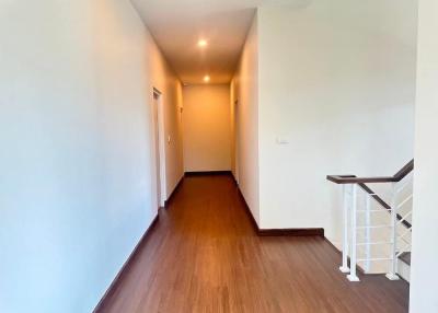 Bright and spacious hallway with wooden flooring