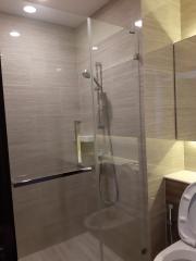 Modern bathroom interior with glass shower enclosure