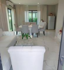 Modern combined living and dining room with natural light