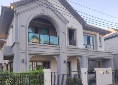 Modern two-story house with balcony and garage