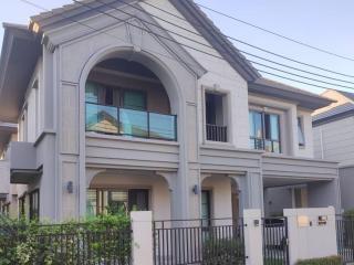 Modern two-story house with balcony and garage