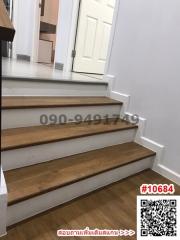 Modern staircase interior with white walls and wooden steps