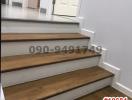 Modern staircase interior with white walls and wooden steps