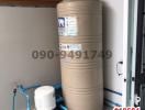 Water filtration system and storage tank in a home utility space