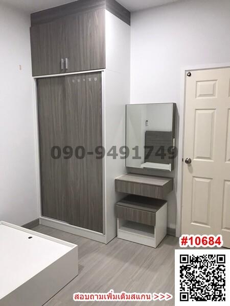 Compact modern bedroom with built-in wardrobe and vanity