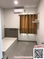 Compact bedroom with air conditioning and golden curtains
