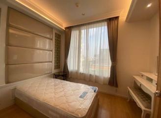 Spacious bedroom with natural light and modern design