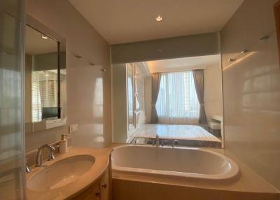 Spacious bathroom with double vanity and large bathtub