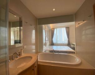 Spacious bathroom with double vanity and large bathtub