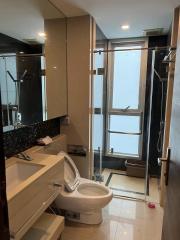 Modern bathroom with a shower cabin and natural light