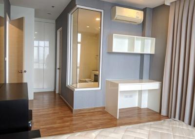 Modern bedroom with built-in wardrobe and work desk