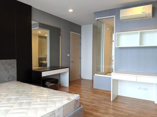 Modern Bedroom with Wooden Flooring and Built-in Furniture