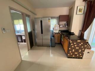 Modern kitchen with stainless steel appliances and mosaic backsplash