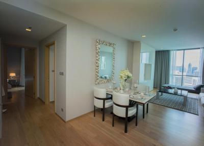 Modern living room with dining area and city view