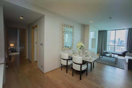 Modern living room with dining area and city view