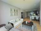 Modern living room leading to an open plan kitchen