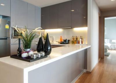 Modern kitchen with stainless steel appliances and breakfast bar