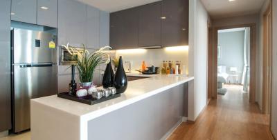 Modern kitchen with stainless steel appliances and breakfast bar