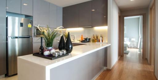 Modern kitchen with stainless steel appliances and breakfast bar